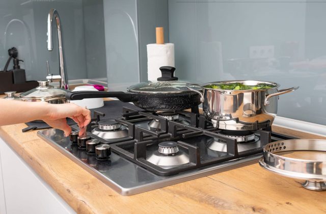 Post-repair function check on a gas hob in a Kharar kitchen